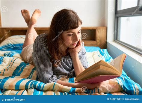 young woman reading  bed stock image image  resting