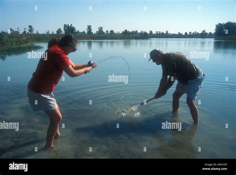 couple catching fish stock photo alamy