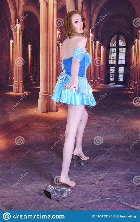 beautiful tall slim busty redhead model dressed as cinderella at the