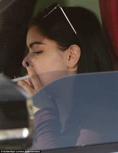 ariel winter smokes a cigarette in her car before treating herself to a