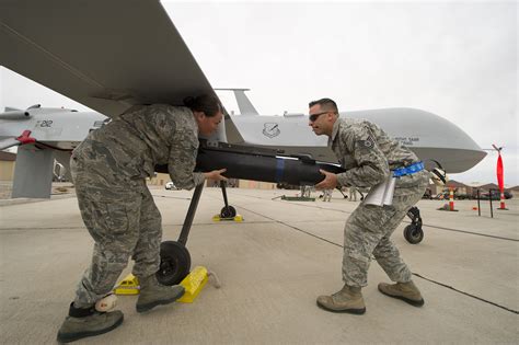 airmen load  inert hellfire missile   predator drone   mexico  april photo air force