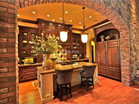 tuscan kitchen  pendant lights  stone arch  tuscan style lighting  great