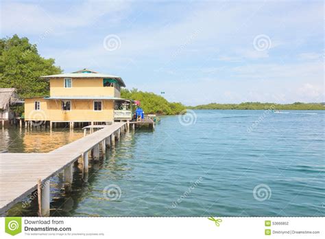 stilt house  water   caribbean sea stock photo image  boat shore