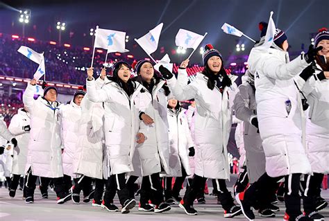 north korea and south korea march together at olympics