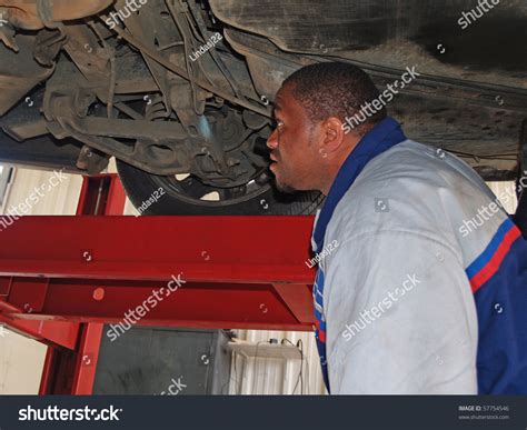 auto mechanic performing  routine service inspection   service