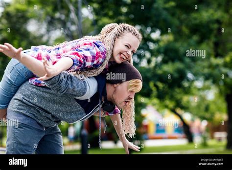 Young Extraordinary Couple Fool Around In The Summer Park The Guy