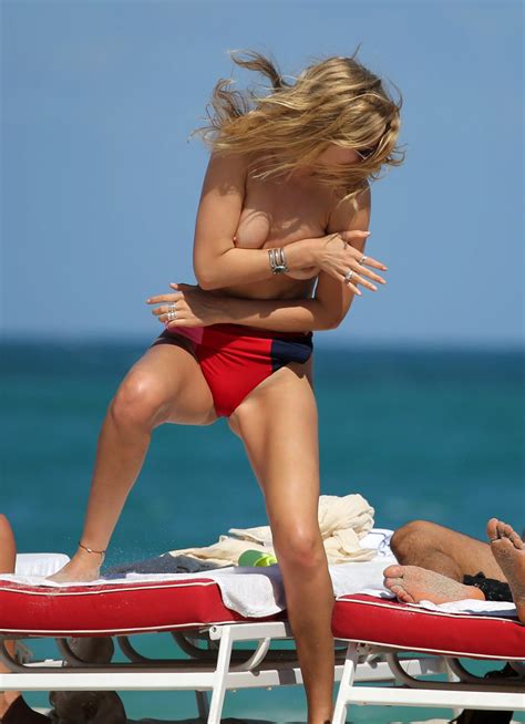toni garrn sunbathing topless on the beach in miami 1065 celebrity