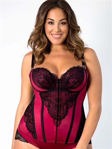 a beautiful black lace is overlaid on panels of rich burgundy and black satin boning to flatter
