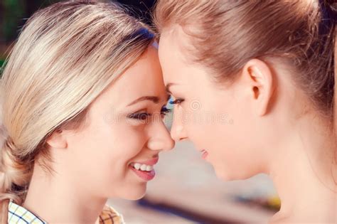 kissing lesbian couple in park stock image image of