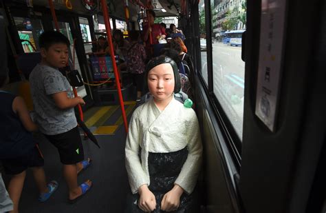 south korea installs statues of comfort women on buses in stark reminder of wwii horror