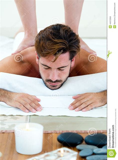 Masseur Doing Massage On Man Body In The Spa Salon Stock