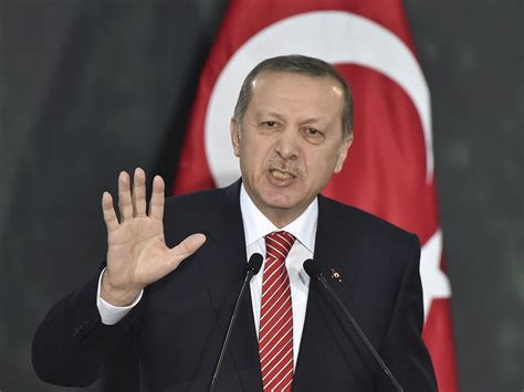 turkish president erdogan threatens editor   showing weapons