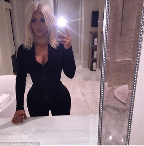 kim kardashian s derriere works overtime in extremely tight fitting black jeans daily mail online