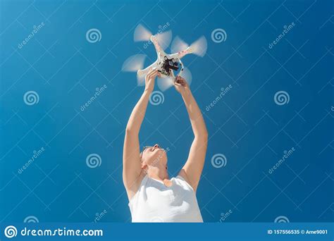 woman starting  drone   video production stock image image  aerial caucasian