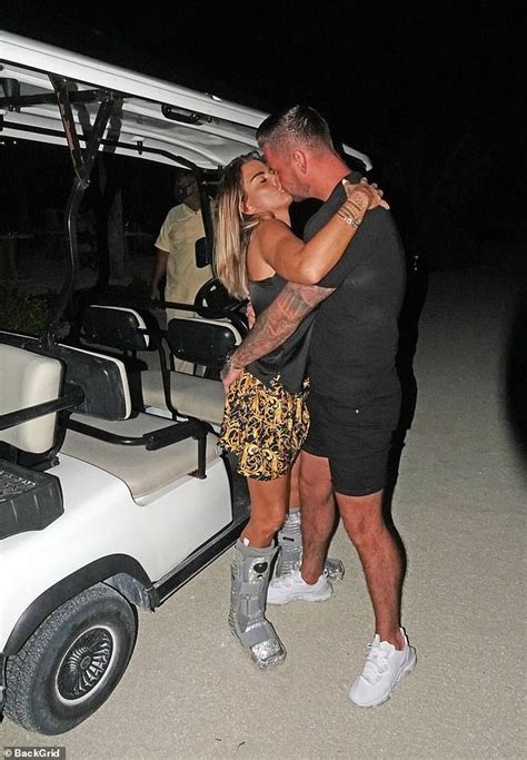 katie price appears as loved up as ever with beau carl woods in the