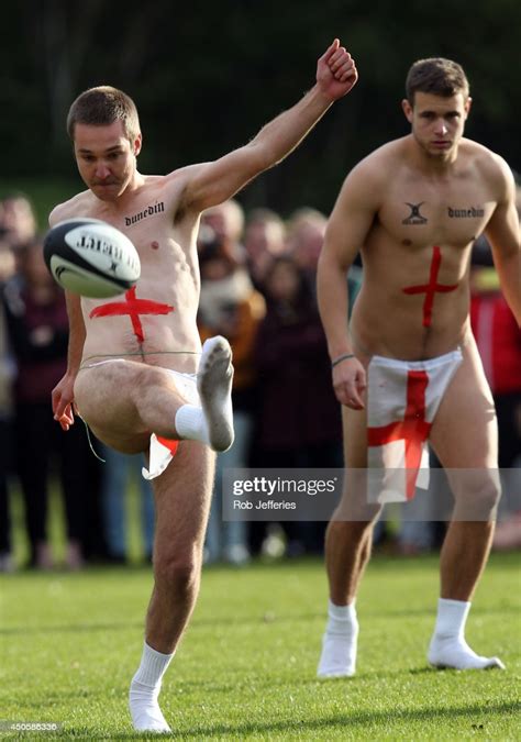 an england player kicks the ball during the naked rugby