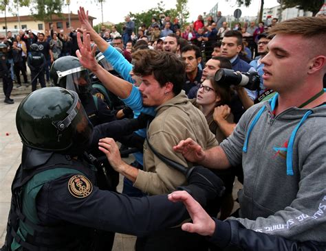 catalonia referendum spanish police smash into polling
