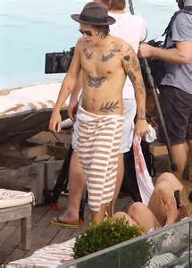 harry styles flips hair back in rio pool revealing new leaf tattoos daily mail online
