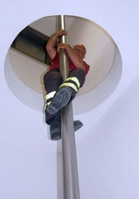 fireman sliding  pole fireman pole image