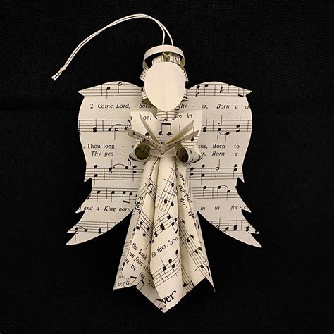 sheet  angel ornament holding  book   hymnal etsy