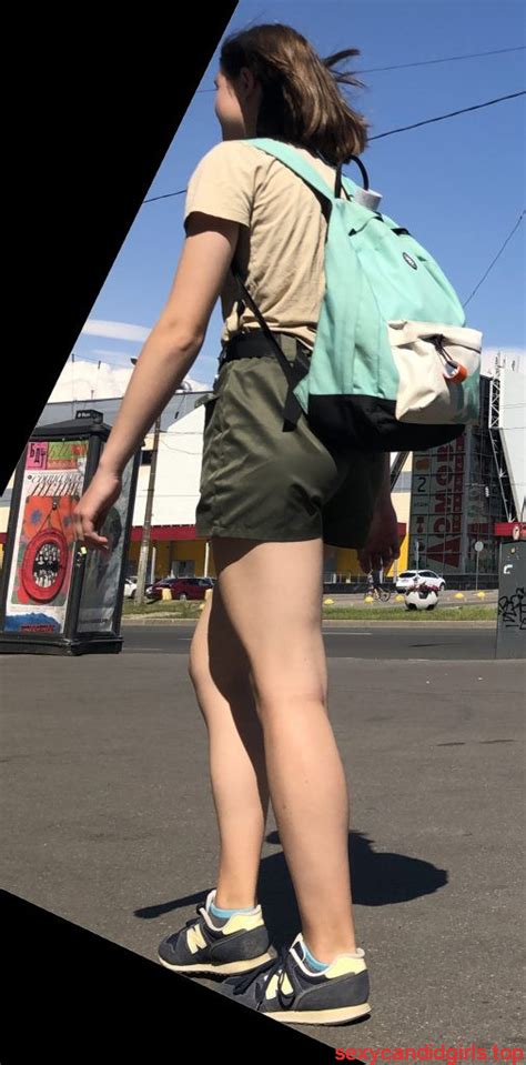 cute dorky girl in shorts with thin muscular legs street
