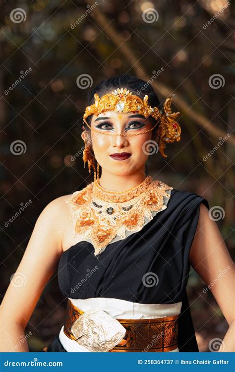 Javanese Woman With Golden Crown And Black Costume Chilling Inside The