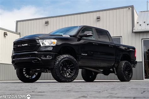 lifted  ram     rough country suspension lift kit   fuel rebel wheels