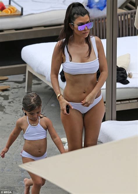 kourtney kardashian shows off her derriere in tiny bikini daily mail