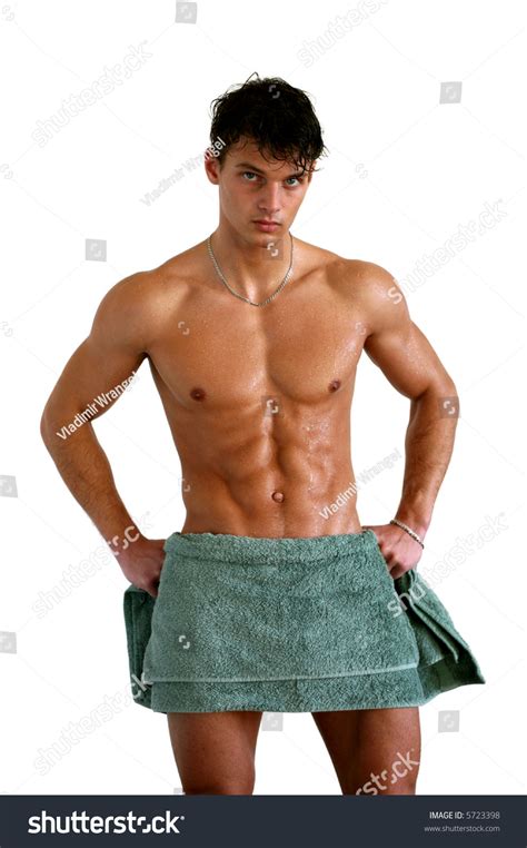Wet Muscular Sexy Man Wrapped In The Towel Isolated On