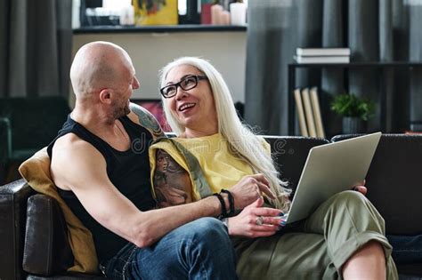 Mature Couple Enjoying Series Online Stock Image Image Of Couch