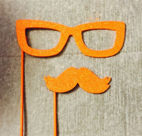 pair  orange glasses   fake mustache