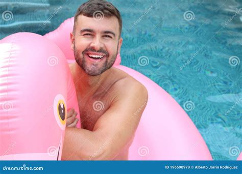 man  inflatable flamingo  swimming pool stock image image  beach muscular