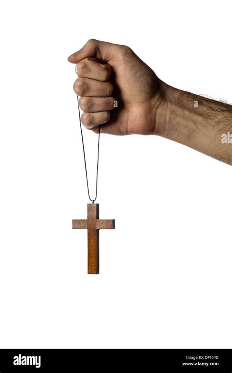 male hand holding wooden cross  white background stock photo alamy