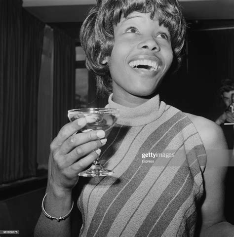 Jamaican Singer Songwriter Millie Small Having A Drink Before Leaving