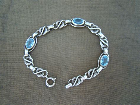 zilveren schakel armband met  ovale blauwe stenen bestel bij mittensnl