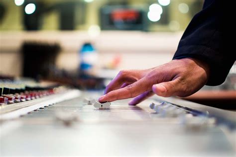 human person holding mixing console  image  photo