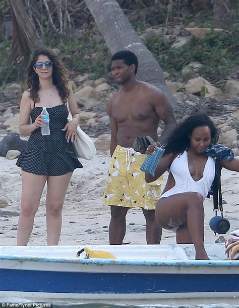 usher hits the beach on holiday with wife daily mail online