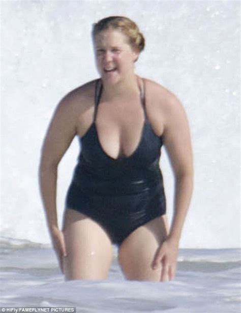 Amy Schumer Makes A Splash In Stylish Black Swimsuit On Beach Break In