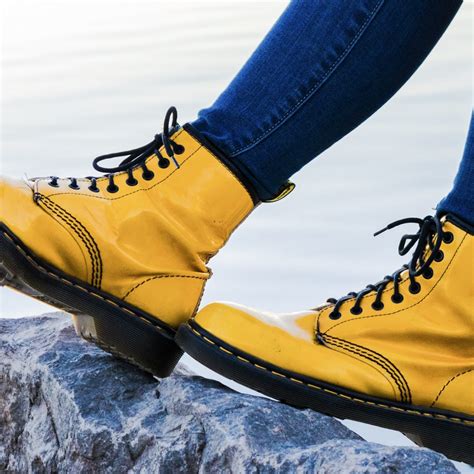 hands  yellow stitching dr martens chiever