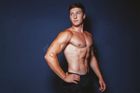 man showing sports figure stock image image  bodybuilding