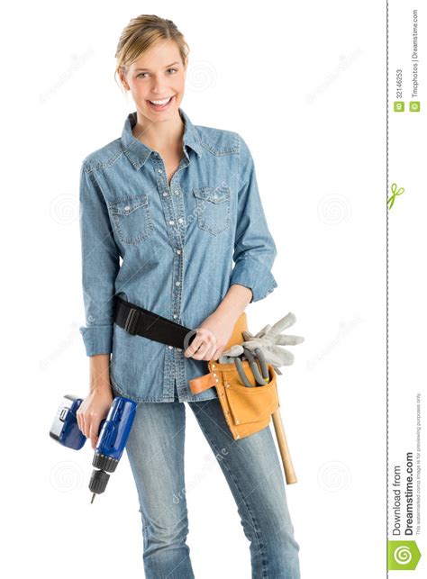 female construction worker with drill and tool belt stock