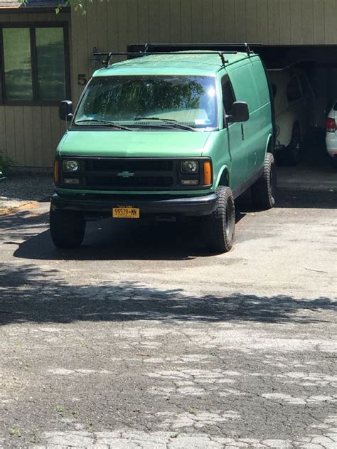 green van parked  front   garage