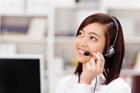 friendly call centre operator chatting   phone stock image image