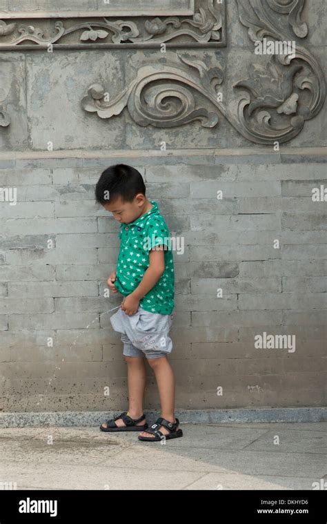 boy urinating  floor xian shaanxi china stock photo alamy