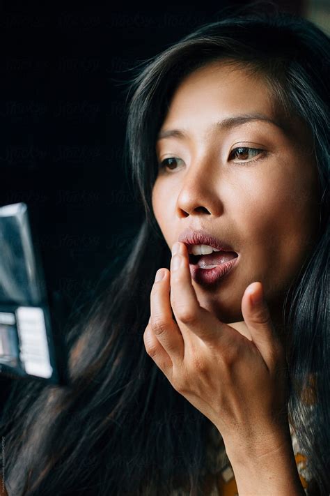 Woman Applying Makeup At Home By Stocksy Contributor Marko Stocksy