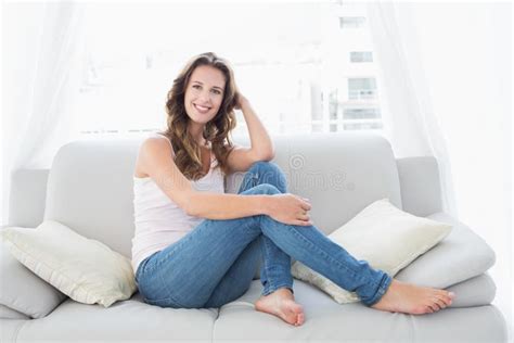 Smiling Young Woman Sitting In Living Room Stock Image Image Of