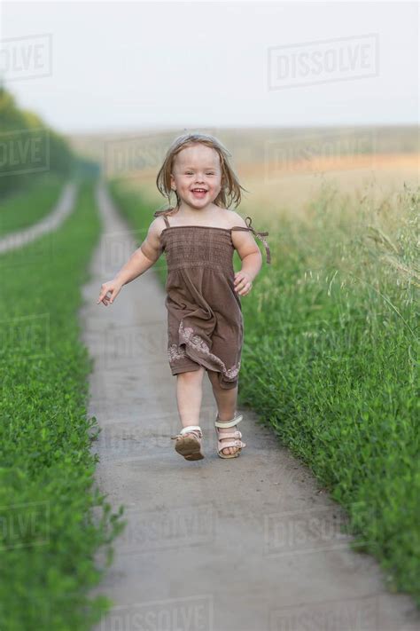 full length portrait  happy  girl walking  nature trail