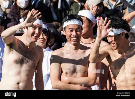 A Foreigner And Japanese Participants Dressed Only In Loincloths Greets