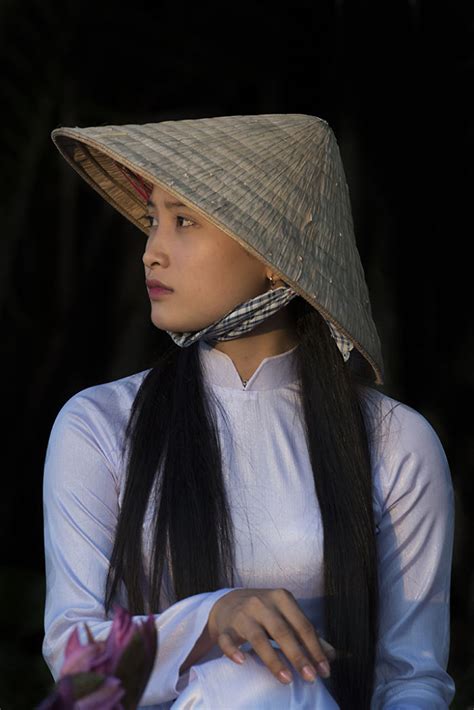 Beautiful Girls Wearing Elegant Ao Dai In Vietnam Bored