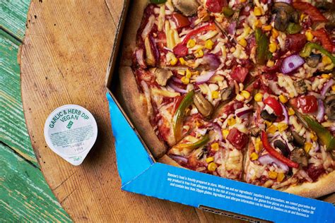 dominos officially adds  vegan pizzas vegan garlic dip